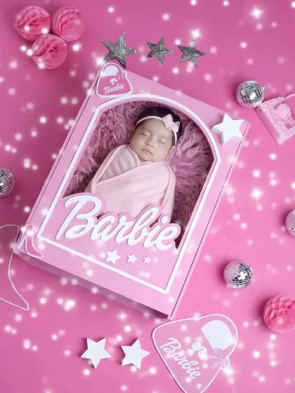 Our Barbie newborn theme is all about sparkle and fun. We use a variety of props and textures to create a vibrant and exciting scene for your baby's portrait.