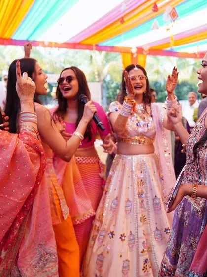 The bride and her squad singing and dancing their hearts out.