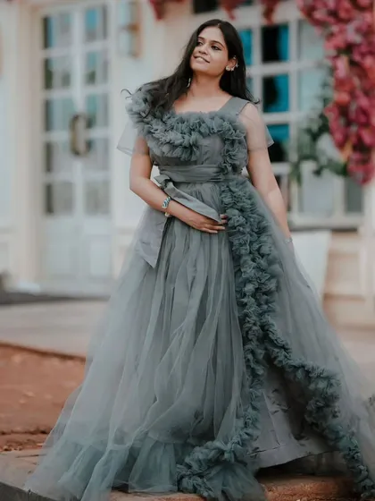 Make a statement at your next event with this elegant grey frill gown. The detailed ruffles and flattering silhouette make it a showstopper for pre-wedding events, birthday parties, or cocktail nights.
