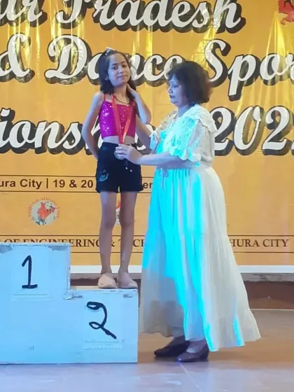 Here is Ipsha on the podium receiving her silver medal at the UP State level Dance Sports Championship. A proud moment for all of us.