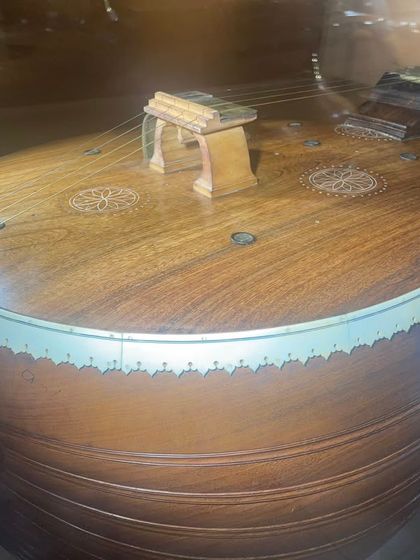 A close-up of a fascinating historical veena I saw at the Venkatappa Art Gallery. This one from the 1950s or 60s has small resonators on the top board, a feature I had never seen before.