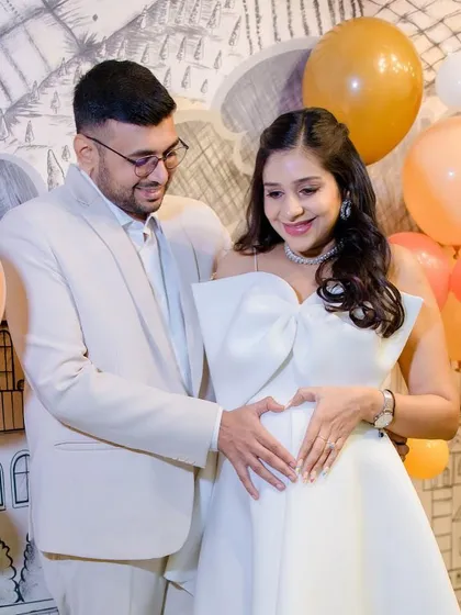 A heartwarming moment with her partner. The makeup is designed to look fresh and natural, capturing the love and excitement of this special time.