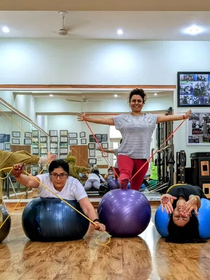 Working with Loop bands, balls, and lovely people! This photo captures the fun and playful spirit of our group classes.