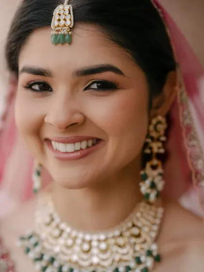 The essence of my philosophy is makeup that enhances, not masks. This close-up shows the soft glam look I love: luminous skin, subtly defined eyes with a warm, neutral shadow, and perfectly groomed brows. It’s about looking like the best version of yourself.