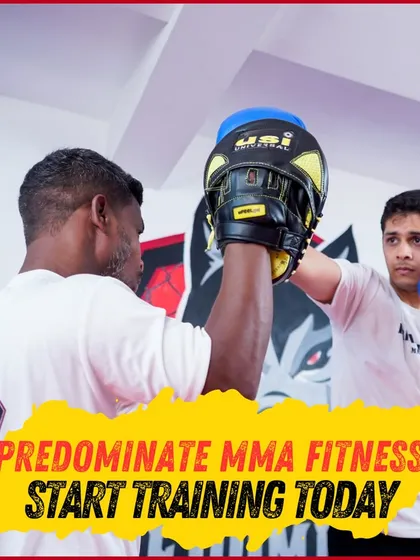 Start training today. A student works on his striking with a coach, demonstrating the personalized guidance we provide.