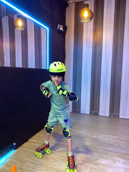 This young skater is ready to roll in his helmet and pads. Safety is the first lesson we teach in our roller skating classes.