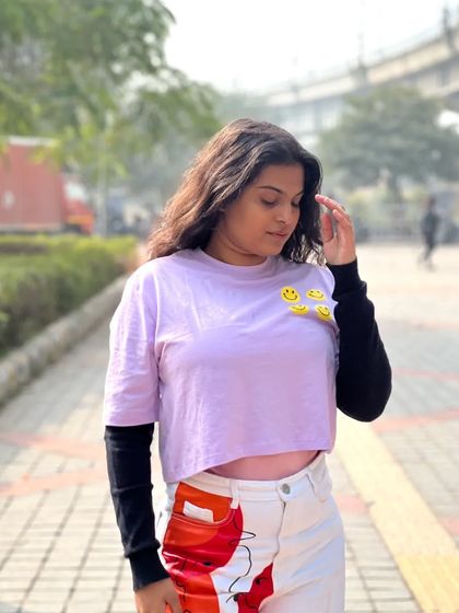 Another angle of the layered top, showing the smiley face details. Even in a simple outfit, small details can add a lot of personality and fun.