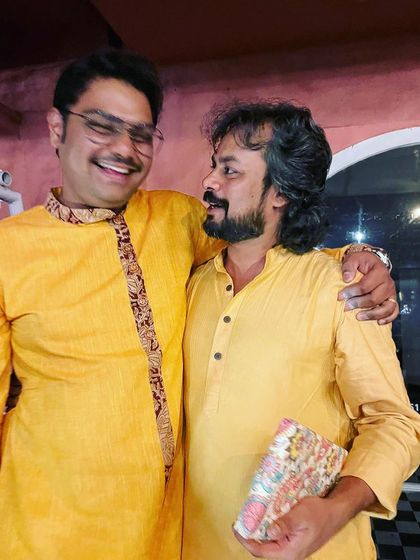 A candid, happy moment with fellow musicians after a successful concert.
