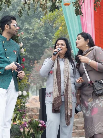 Creating cherished memories becomes even more special when the entire family takes the stage together. Here I am engaging with the family at a Mehendi ceremony.