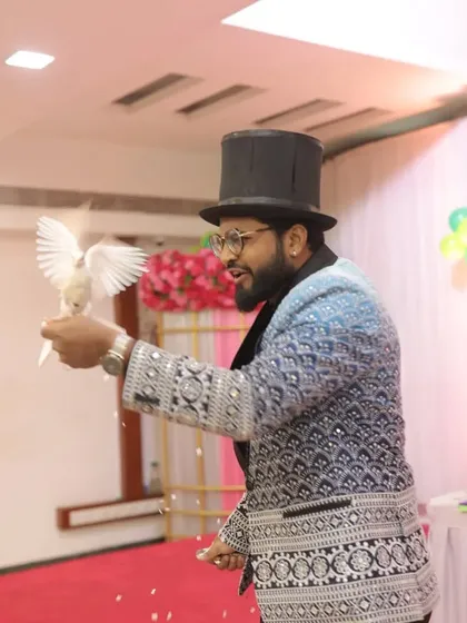 A dove takes flight after being magically produced. This is a dynamic action shot that captures the excitement and beauty of my live animal magic act.