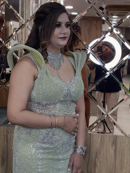 A candid shot of our client, looking effortlessly glamorous with her styled hair and makeup.