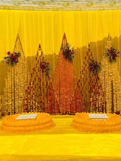 A wider view of the marigold-themed Haldi stage, showing the classic yellow color palette that is perfect for this ceremony.