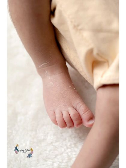 Another angle focusing on the delicate toes and soft skin of a newborn's foot. These macro shots are perfect for remembering every single detail.