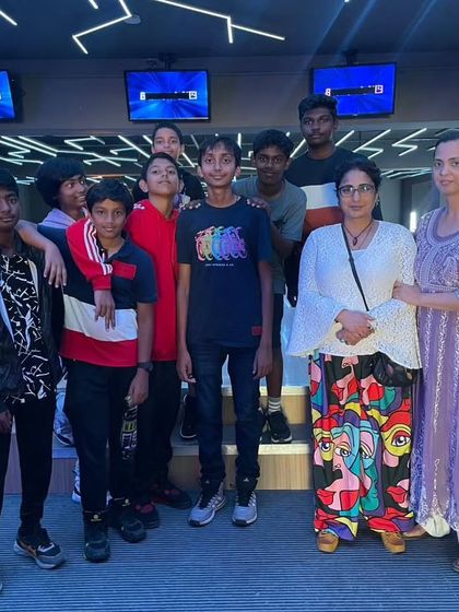 A family and friends group posing at the bowling alley.