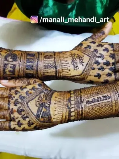 This design for 'Sameer's Bride' features unique crisscross patterns on the back of the hands. The arms are filled with a mix of traditional bands and script.