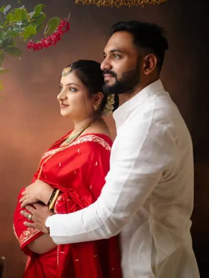 A close-up profile shot of the couple, highlighting their connection and the traditional details of their attire. The soft lighting creates a warm and intimate mood.