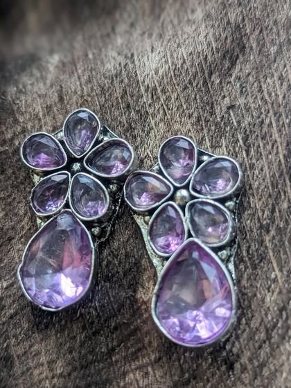 These purple silver replica studs were one of the cutest in my collection. The floral design with sparkling purple stones was a huge hit.