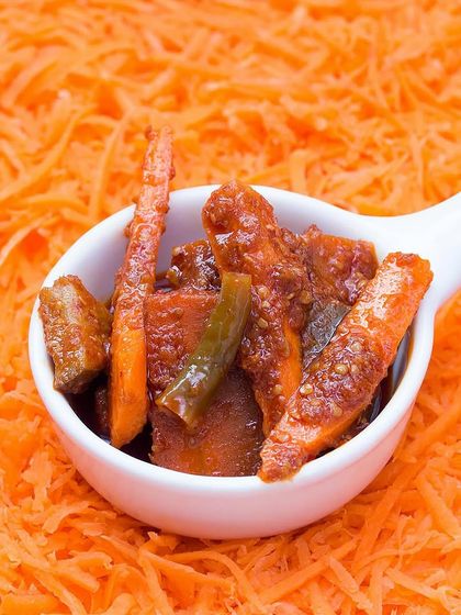 A spoonful of our Carrot Chilli Pickle, served over a bed of grated carrots. The sweet crunch of the carrots is perfectly balanced by the heat of the chillies and spices.