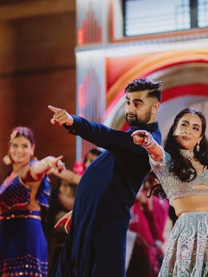 A high-energy, perfectly synchronized moment from a couple's duet. This shows that we can choreograph for all energy levels, from slow romantic numbers to upbeat Bollywood tracks.
