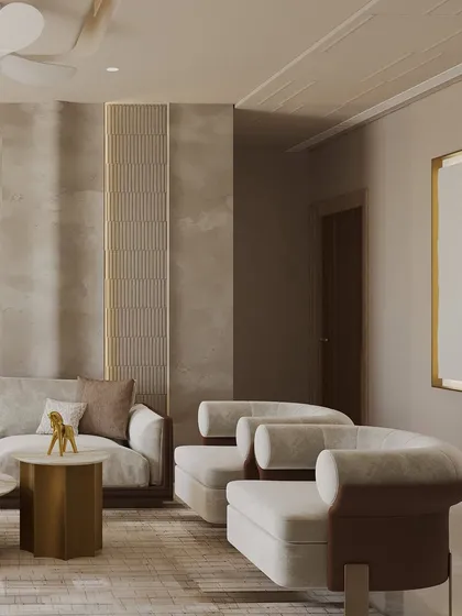 Texture plays a key role in this living room, from the lime-washed walls with fluted details to the soft upholstery of the furniture. The design is a quiet celebration of form, material, and emotion coming together.