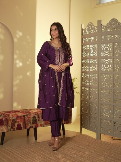 A beautiful deep purple suit set that exudes royalty. The fine embroidery on the neckline and dupatta makes it a luxurious addition to any festive wardrobe.