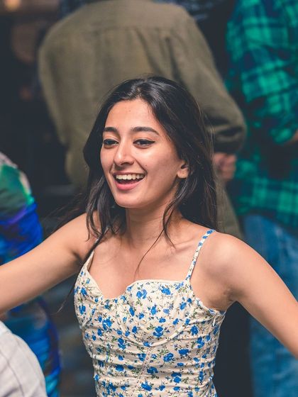 A shot of someone dancing with pure joy on their face. This is the result I work for every night.