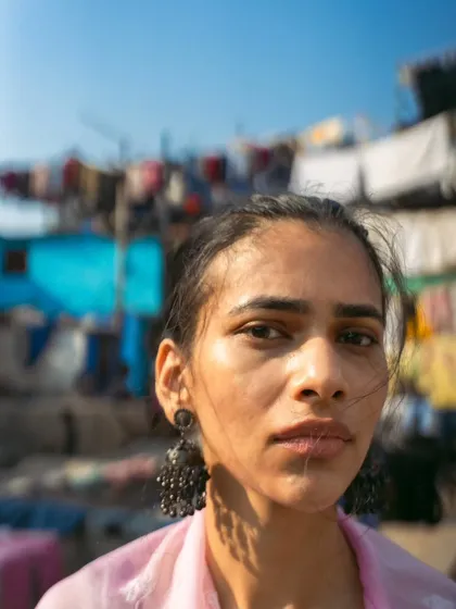 This was shot at the iconic Dhobi Ghat. The goal was to create a powerful portrait that feels authentic to the location, using the textures and colors of the background to frame the subject's expression.