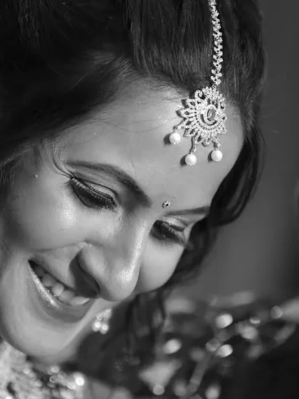 For us, it's all about the real emotions. This candid, black and white shot captures a genuine moment of joy and connection between the couple during their wedding celebration.