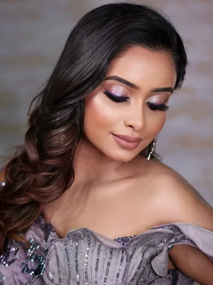 A dreamy, ethereal look featuring a holographic purple liner. Perfect for a cocktail or reception event.
