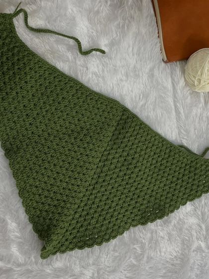 Another flat-lay of the bandana, ready to be folded and tied. The granny stitch pattern is lightweight and has a lovely drape.