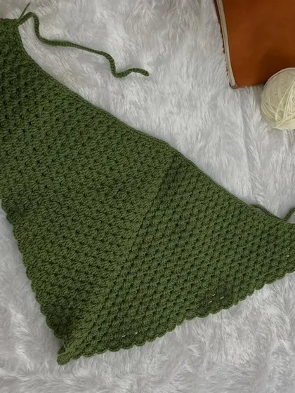 Another flat-lay of the bandana, ready to be folded and tied. The granny stitch pattern is lightweight and has a lovely drape.