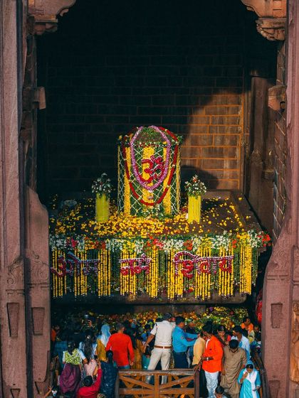 The 18-foot tall Shiva Linga at Bhojpur Temple, carved from a single stone. Devotees gather to offer their prayers at this ancient and powerful site.