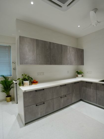 Another angle of the wet kitchen, showing the simple, clean lines and durable finishes that make it a practical workhorse.