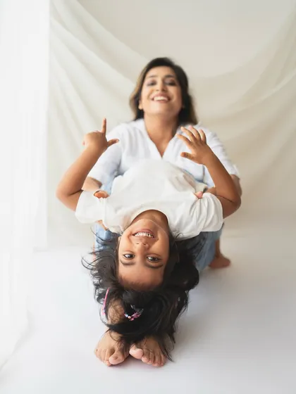 Silly moments make the best memories! This playful upside-down shot shows the fun and laughter I love to capture in my family sessions.