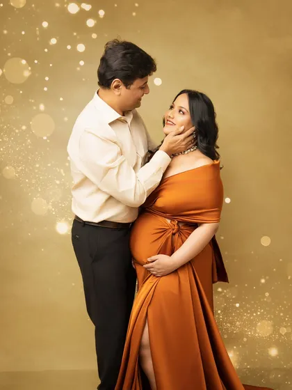 A tender moment captured in a modern, glamorous style. The focus is on the couple's loving gaze and gentle embrace, creating a portrait that is both stylish and full of emotion.