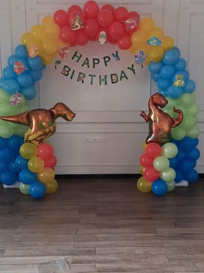 A simple and fun dinosaur themed balloon arch, perfect for a party entrance or a photo backdrop at home.