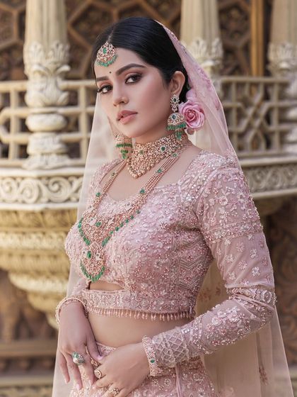 A regal portrait of the bride, her makeup looking flawless and her pose exuding confidence and grace.