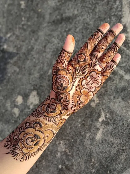 A beautiful design featuring a mix of floral elements and personalized details, including a heart with "Bhai ki Sagai" for an engagement party.