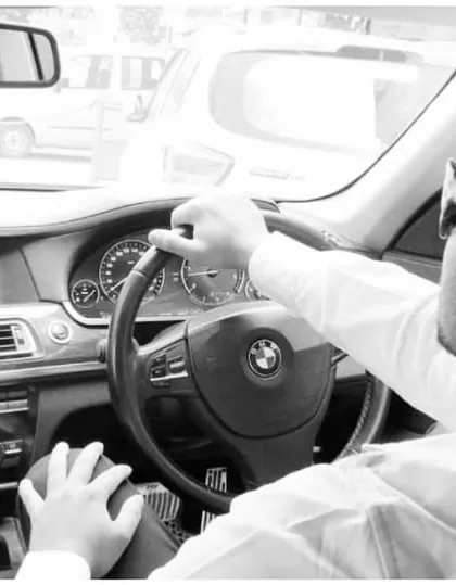 Behind the wheel of a BMW. I believe that the drive for excellence should be reflected in all aspects of life.