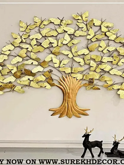 This unique wall art piece depicts a tree with butterfly-shaped leaves, all handcrafted from metal with a beautiful antique golden finish. It includes backlighting to create a magical, glowing effect, symbolizing growth and transformation.