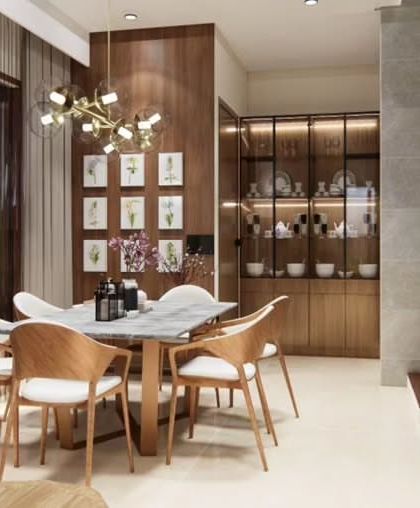 The dining area of the Odion Woods villa, with a modern chandelier and a crockery unit with thin black profile aluminum frames for a minimal, contemporary look.