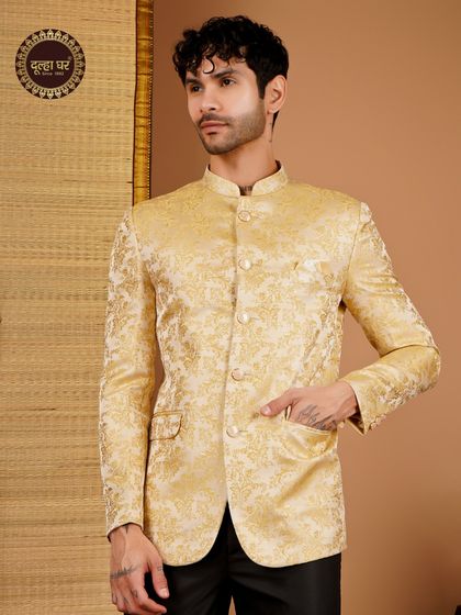 Dress like royalty, celebrate in style. A golden brocade Bandhgala jacket paired with black trousers for a classic and regal combination.