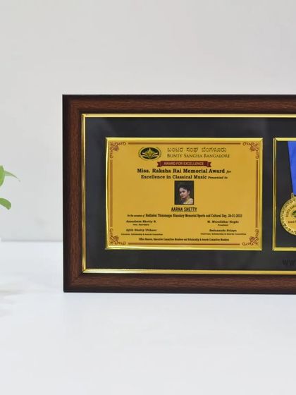 We can frame certificates and medals together for a complete and distinguished award. This piece was created to honor an achievement in classical music, showcasing our versatility beyond corporate awards.