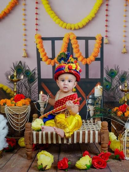 Our Little Krishna, complete with a colorful turban and flute. This is one of our most beloved traditional themes, perfect for celebrating your baby's divine innocence.