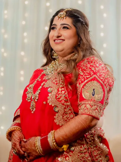 A collection of moments from this bride's reception. Her look was all about soft glam, with flowing waves and makeup that highlighted her joyful smile, creating a perfect look for her evening celebration.