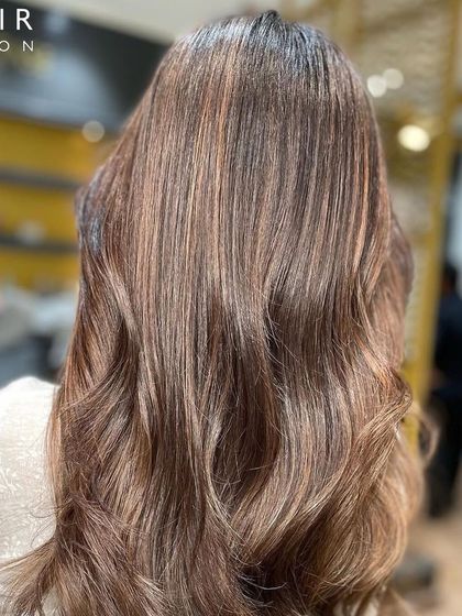 The back view of this gorgeous balayage, showcasing the seamless blend and the healthy shine of the hair.