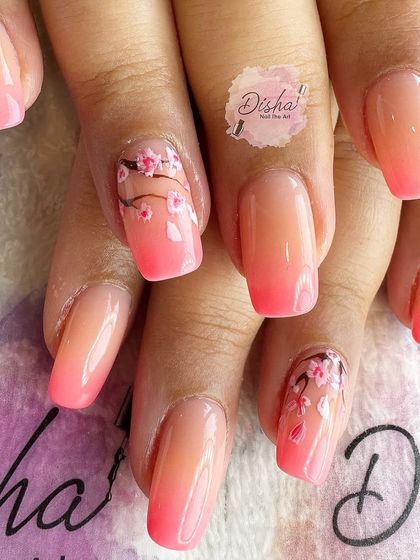 Hello Spring. This fresh set of nails features a peachy-pink ombre with delicate, hand-painted cherry blossoms.