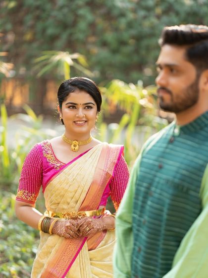 A candid shot from a pre-wedding event. The bride's makeup looks fresh and natural, perfect for these unposed, in-between moments.