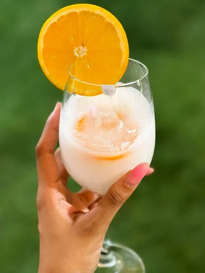 My Brazilian Lemonade Slush is the ultimate thirst quencher. This creamy, tangy, and sweet frozen drink is incredibly refreshing and perfect for a hot day, garnished with a fresh orange slice.