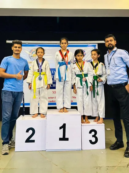 Our students shine at the CISCE Taekwondo Competition. Here are our winners on the podium with their coaches after securing gold and bronze medals in Kyorugi.